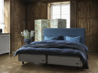 Bed with Astoria headboard by Duxiana