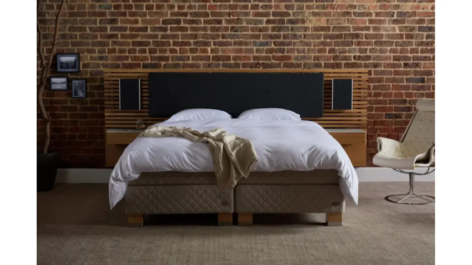 Bed with Audio headboard by Duxiana