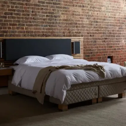 Bed with upholstered fabric and Duxiana wood headboard