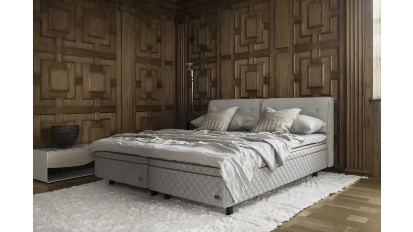Bed with quilted Duxiana fabric headboard Faruk