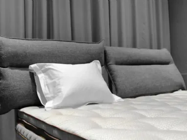 Bed with Flex Soft headboard by Duxiana