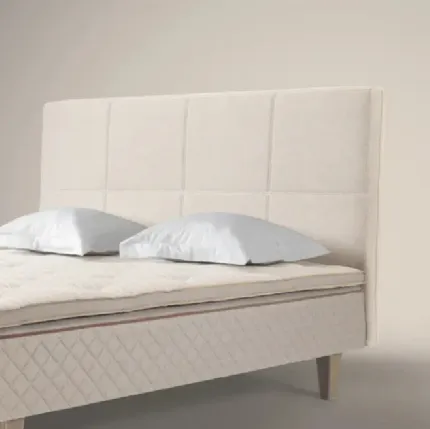 Bed with Quadro headboard by Duxiana