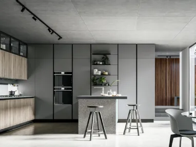 Modern kitchen with Round 04 peninsula in laminate and PET by Arredo3.